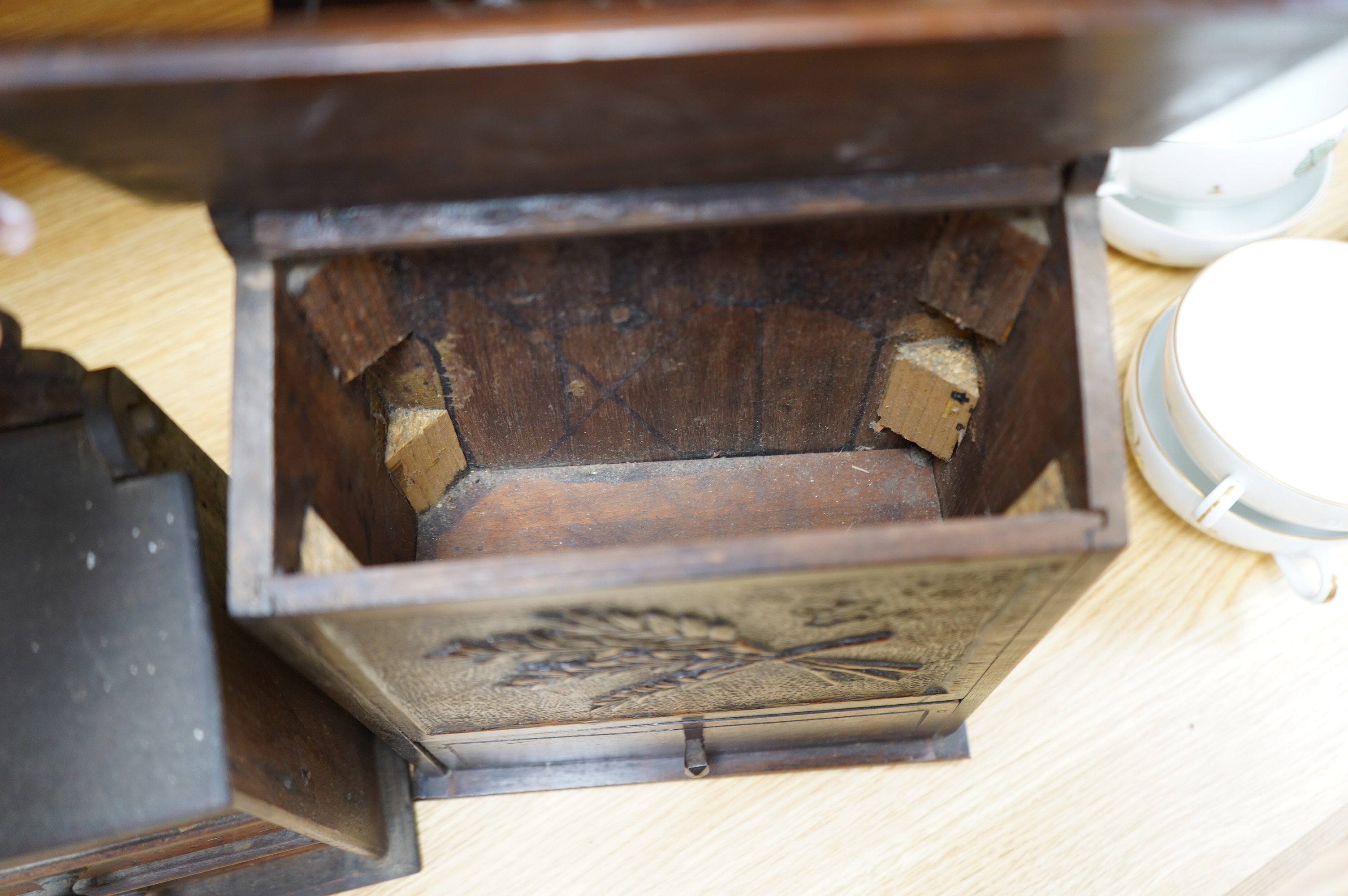 Two 19th century carved beech salt boxes, largest 40cm high. Condition - fair